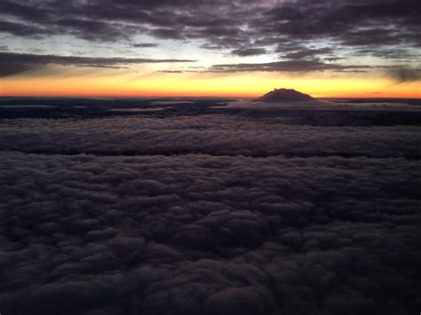 Sunrise Behind Mount Rainier On A Early Flight Out Of Seattle