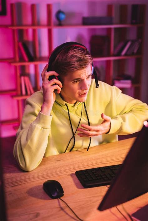 Concentrated Young Gamer In Headset Play Stock Photo Image Of Online