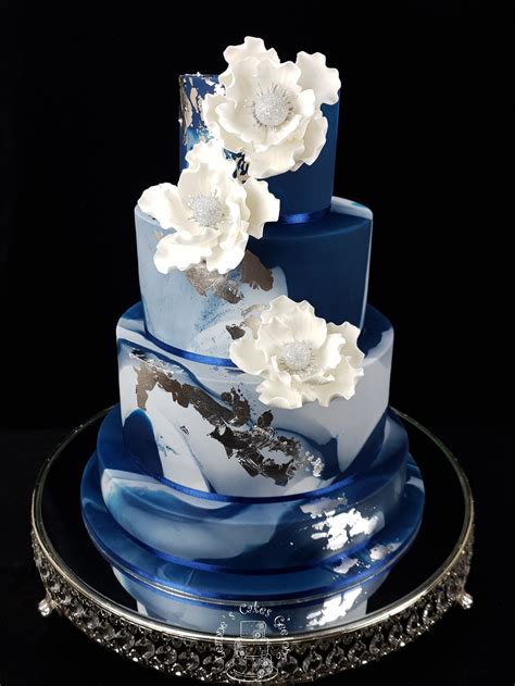 Magnificant Marble Wedding Cake In Navy With Silver Leaf And White