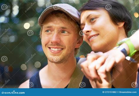 Spending Some Quality Time A Happy Young Couple Holding Hands Outdoors