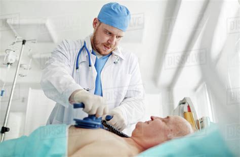Doctor Trying To Save The Patient At Hospital Stock Photo Dissolve