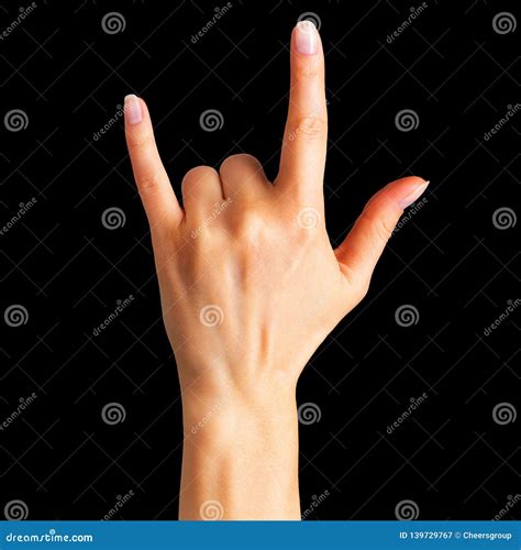 Female Hand Showing Rock N Roll Sign Or Giving The Devil Horns Gesture
