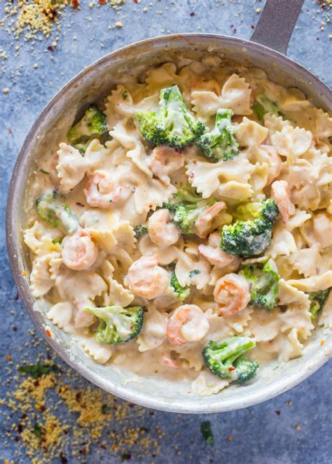 The recipe combines fettuccine noodles, with gulf shrimp in a creamy sauce made from milk and cream cheese. Skinny Garlic Shrimp & Broccoli Alfredo | Gimme Delicious