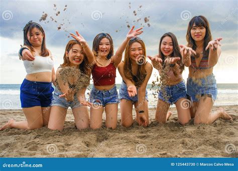 Portrait Of Happy And Cheerful Group Of Asian Korean And Chinese Young Women Girls Playing
