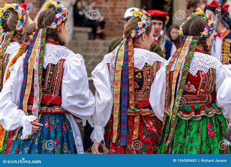 traditional polish folk costumes on parade in krakow main market square editorial photo