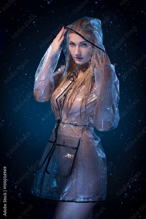 Attractive Blonde Naked Woman In Raincoat Posing During Rain Stock