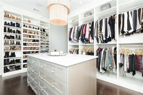 My closet plan involves building square cubbies, but the first step is to build three simple shelves spanning the. Wall of custom shoe shelves in a large master closet ...