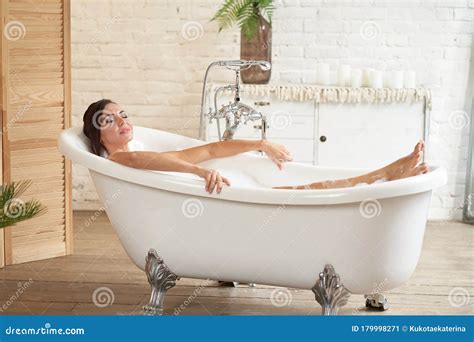 Gorgeous Beautiful Female Takes A Bath Relax In A Bubble Bath Stock