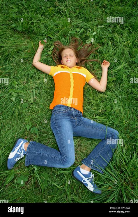 Girl Lying On Her Back In Strange Pose Either Sleeping Injured Or Dead