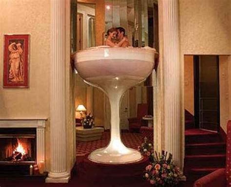Romance fills the air in this beautiful romantic suite at diamond cliff resort & spa with a swinging chair and welcome heart shaped rose petals on the bed. Caesars Pocono Resorts | Resorts, Bubble baths and Jordans