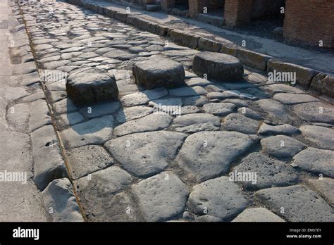 Pompeii, Italy. Raised stepping stones across the cobbled street at Stock Photo, Royalty Free ...