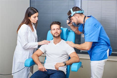 A Doctor Examining The Patient Stock Photo Image Of Consulting