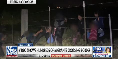 Exclusive Video Shows Hundreds Of Migrants Crossing Southern Border
