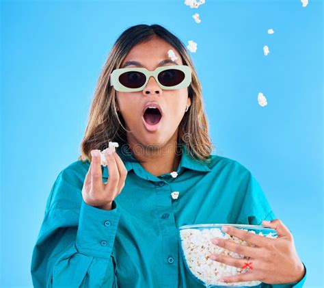 3D Movie Popcorn And Surprise With A Woman In Studio On A Blue