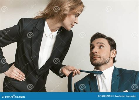 Female Boss Seduces Employee Young Naughty Businesswoman Holding Jacket Collar Of Businessman