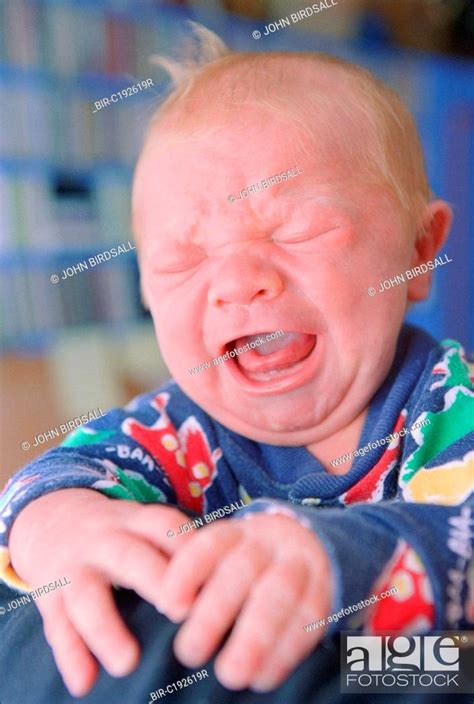 Portrait Of Newborn Baby Crying Stock Photo Picture And Rights