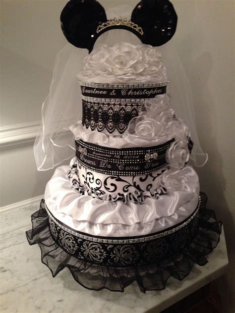 Each one is lovingly wrapped and stuffed with select items to match that occasion or that person. Disney inspired wedding towel cake wrapped in embroidered ...