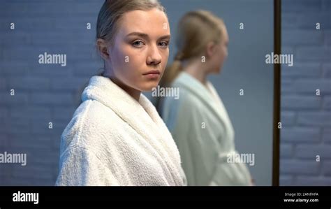 Pensive Teen Girl In Front Of Mirror Hi Res Stock Photography And