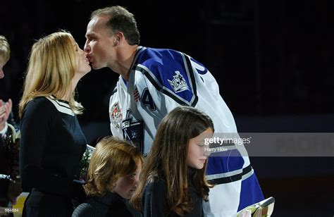 Player overview & base stats. Kelly Buchberger of the Los Angeles Kings kisses his wife ...