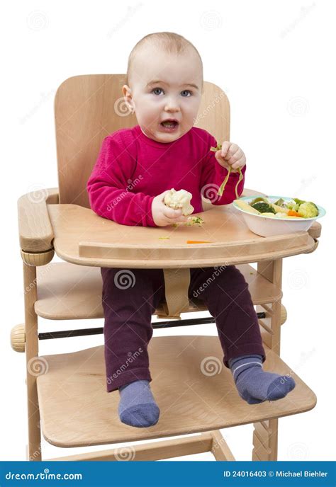 Young Child Eating In High Chair Stock Image Image Of Eating Lumber