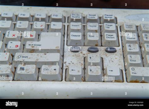 A Fragment Of A Dirty And Dusty Computer Keyboard Close Up Stock Photo