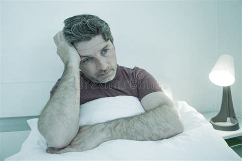 Man Suffering Depression Problem Dramatic Portrait At Home Of Sad And
