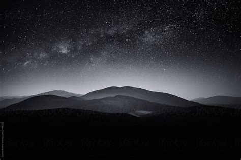 Night Landscape With Stars Over Mountain At Night By Stocksy