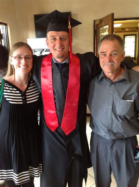 Graduate Justin Hansen with his fiancé, Kelsey, and his dad, at the