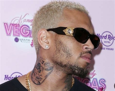 #rihanna #chris brown #breezy #battered face #chris brown tattoos. Has Chris Brown Tattooed Rihanna's Face on His Neck?