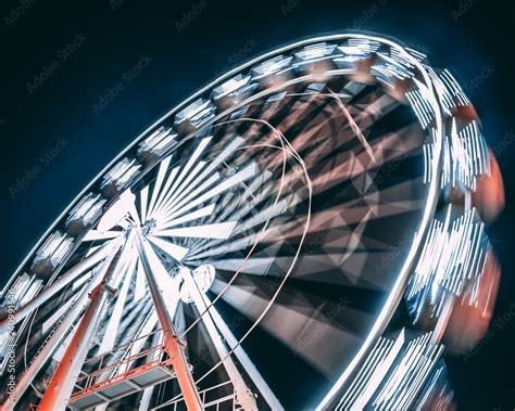 Motion Of Ferris Wheel At Night Stock Photo Adobe Stock