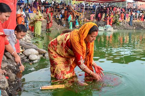 Making Offerings During The Chhath Puja Festival In Nepal