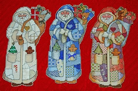 13 Cross Stitched Santas