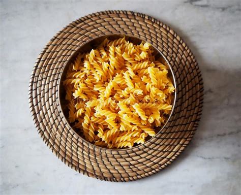 Fusilli A Type Of Pasta From South Italy In A Bowl On A Straw Round