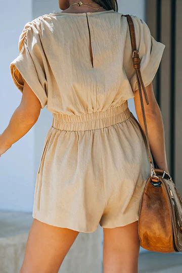 Pair The Take A Vacation Romper With A Straw Hat And A Glass Of