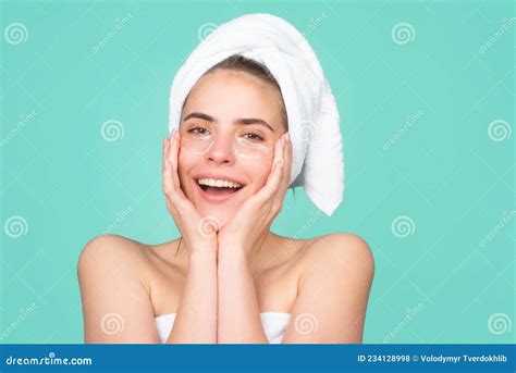 Smiling Woman With A Facial Mask Charming Pretty Model After Bath Wrapped In Towel Applying