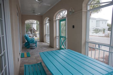 Typically with an outdoor patio you will want a material that holds up well under adverse weather conditions. beach-house-enclosed-patio-furniture - Palmer Davis Design, LLC