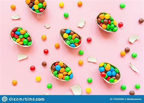 Download Chocolate Easter Eggs And Colorful Candies On Pastel Pink Paper Background. Flat Lay, Top View ...