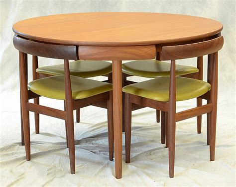 These chairs offer a wide range of. Compact dining room table marked Rem Rojle, made in Denmark,