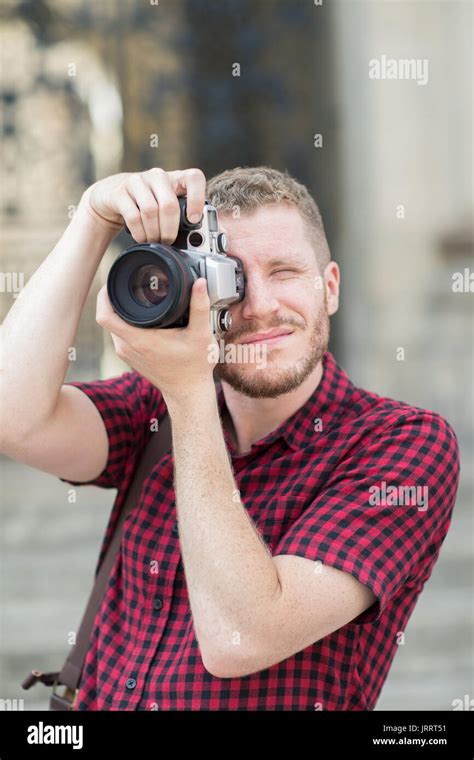 Male Photographer Working In Street Stock Photo Alamy