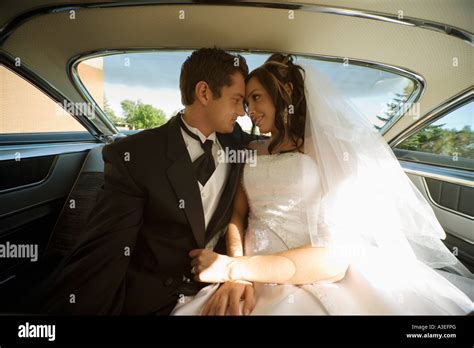 Bride And Groom Inside Wedding Car Stock Photo Alamy