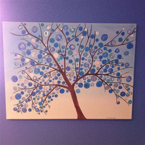 A Painting Of A Tree With Blue Circles On It S Trunk Is Hanging On The Wall