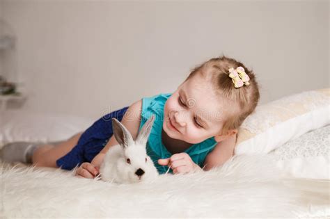 Cute Little Girl Playing With White Rabbits Stock Image Image Of