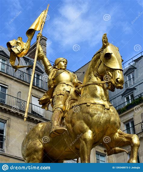 Paris France Joan Of Arc Golden Statue Blue Sky With White Clouds
