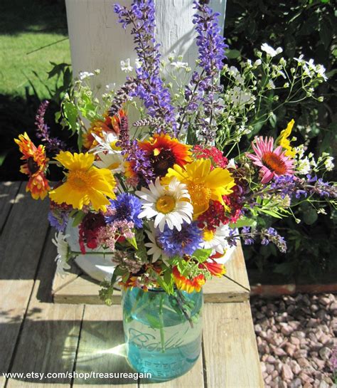 These jars are full of the best of the season. centerpiece idea | Mason jar flowers, Mason jar flower ...