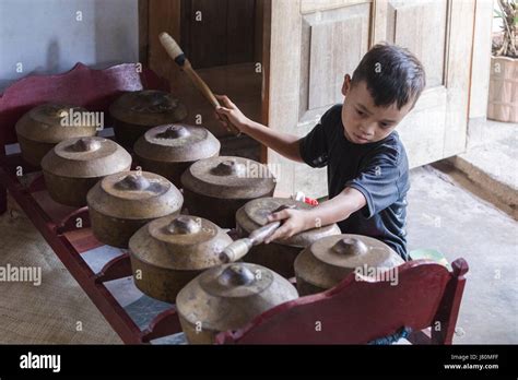 Boy Playing Traditional Gamelan Drums In Magelang Borobudur Java