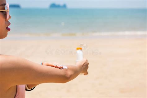 Girl Applying Sun Lotion On The Beach Stock Photo Image Of Spread Sunblock