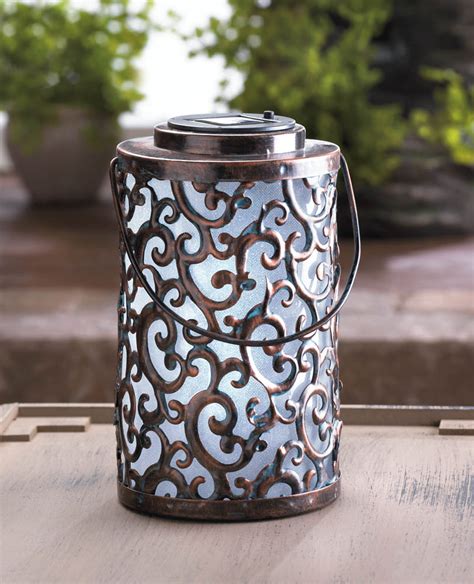 Lantern decoration ideas are sure to provide plenty to gab about, for both your walls and the people bustling about inside! Garden Gate Solar Lantern Wholesale at Koehler Home Decor