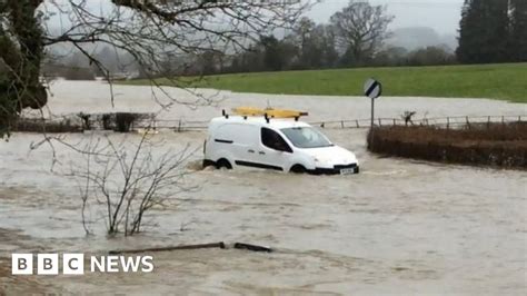 Flood Rescues After Two People Get Trapped In Cars Bbc News