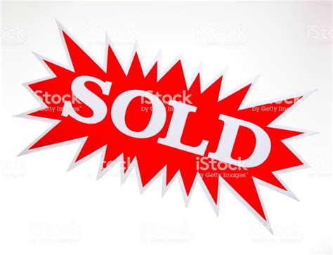 A Sold Sign In The Shape Of A Red Burst White Background Real