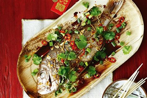 Red snapper is simply marinated in oil, cumin, chili powder and lime juice, then it's drained & broiled until it flakes apart easily. Whole snapper with garlic and ginger